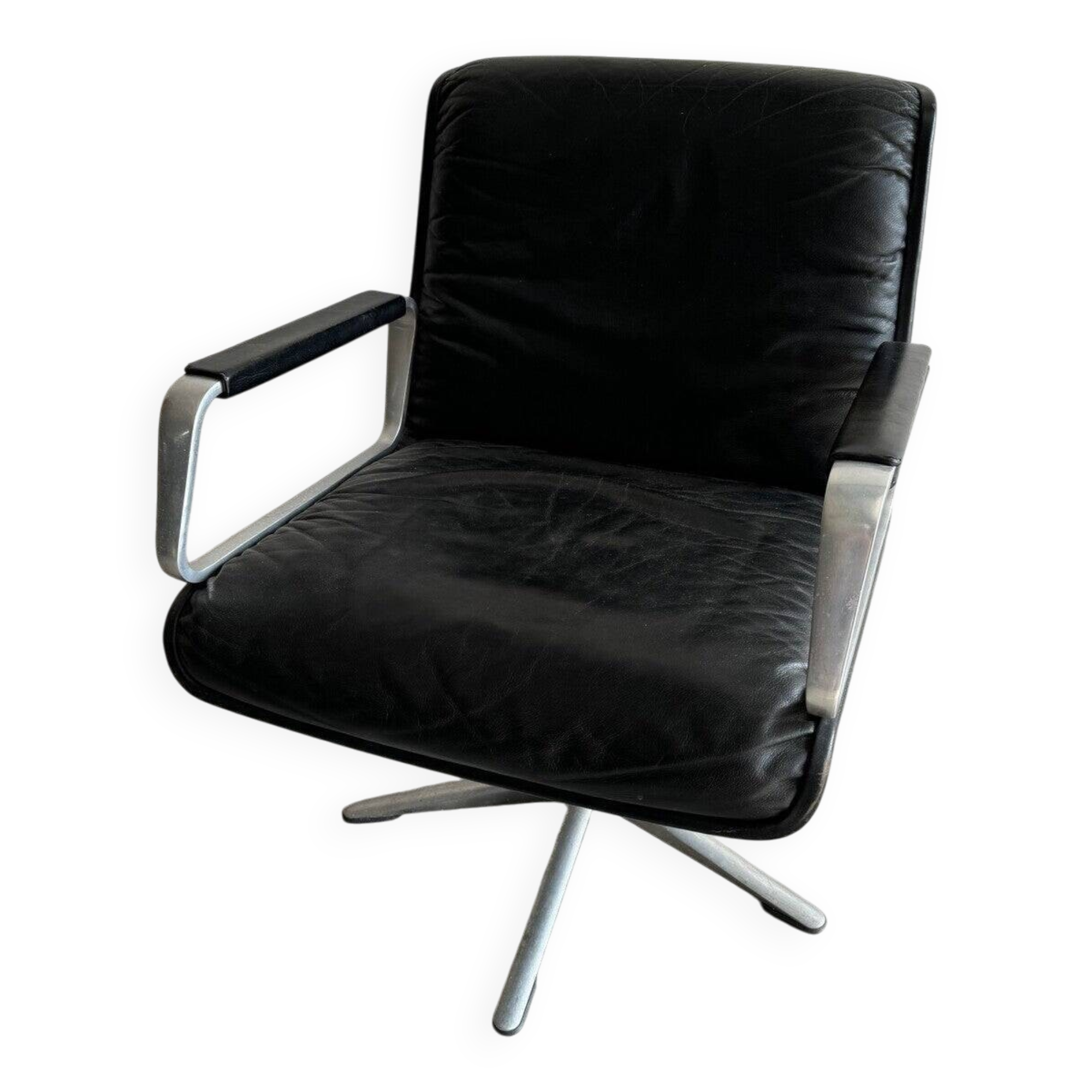 Wilkhahn Delta lounge chair in black leather with polished aluminum base and footrest (1970s)