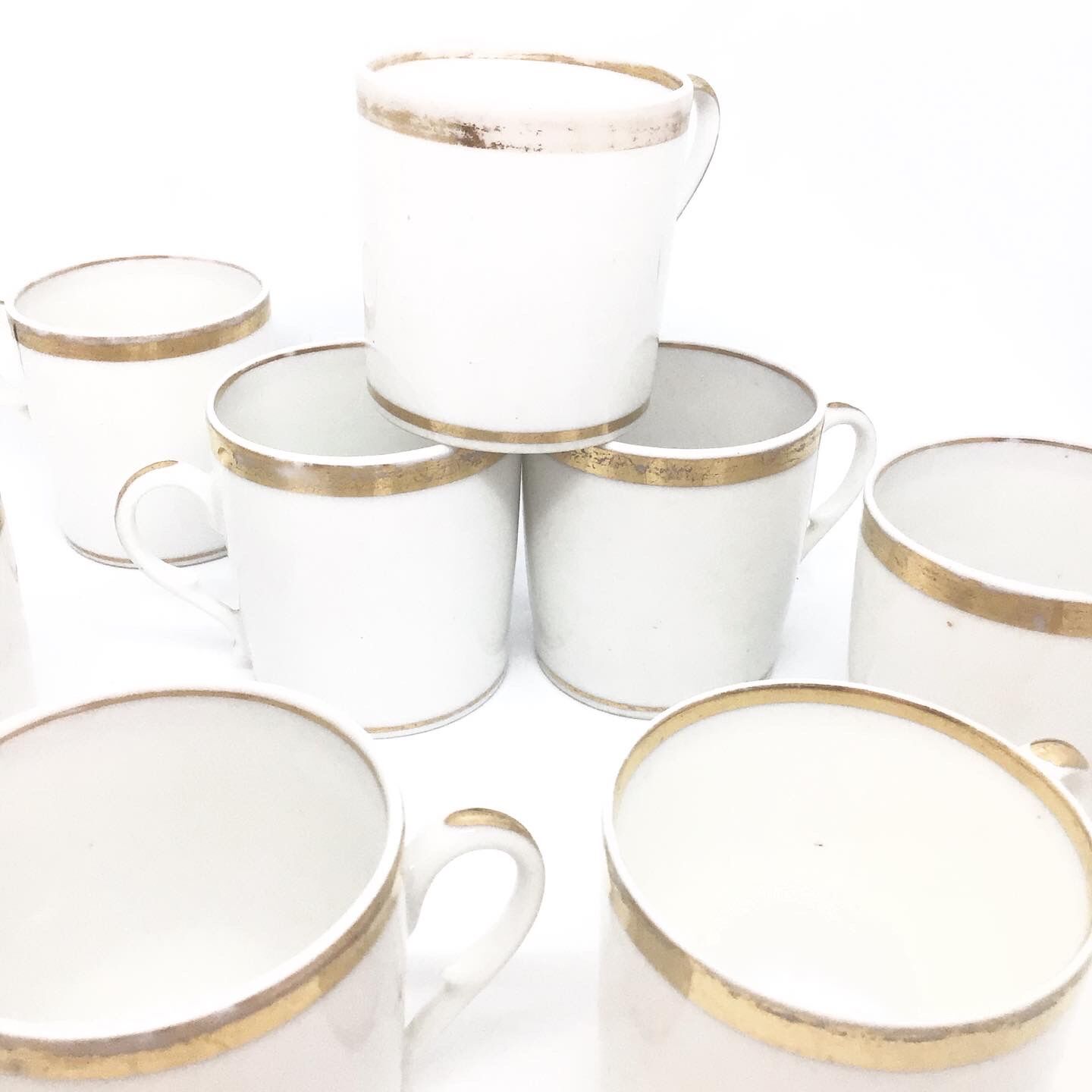 Lot of eight coffee cups and under cups