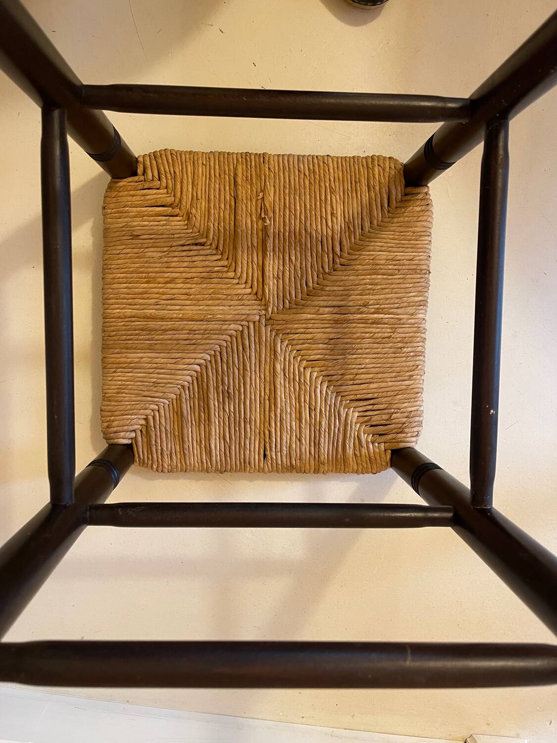 High stool made of wood and straw