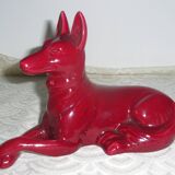 Saint Clement. Dog lying in earthenware