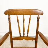 Antique oak and elm wooden armchair with cane seat