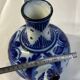 Glazed ceramic carafe with floral decoration