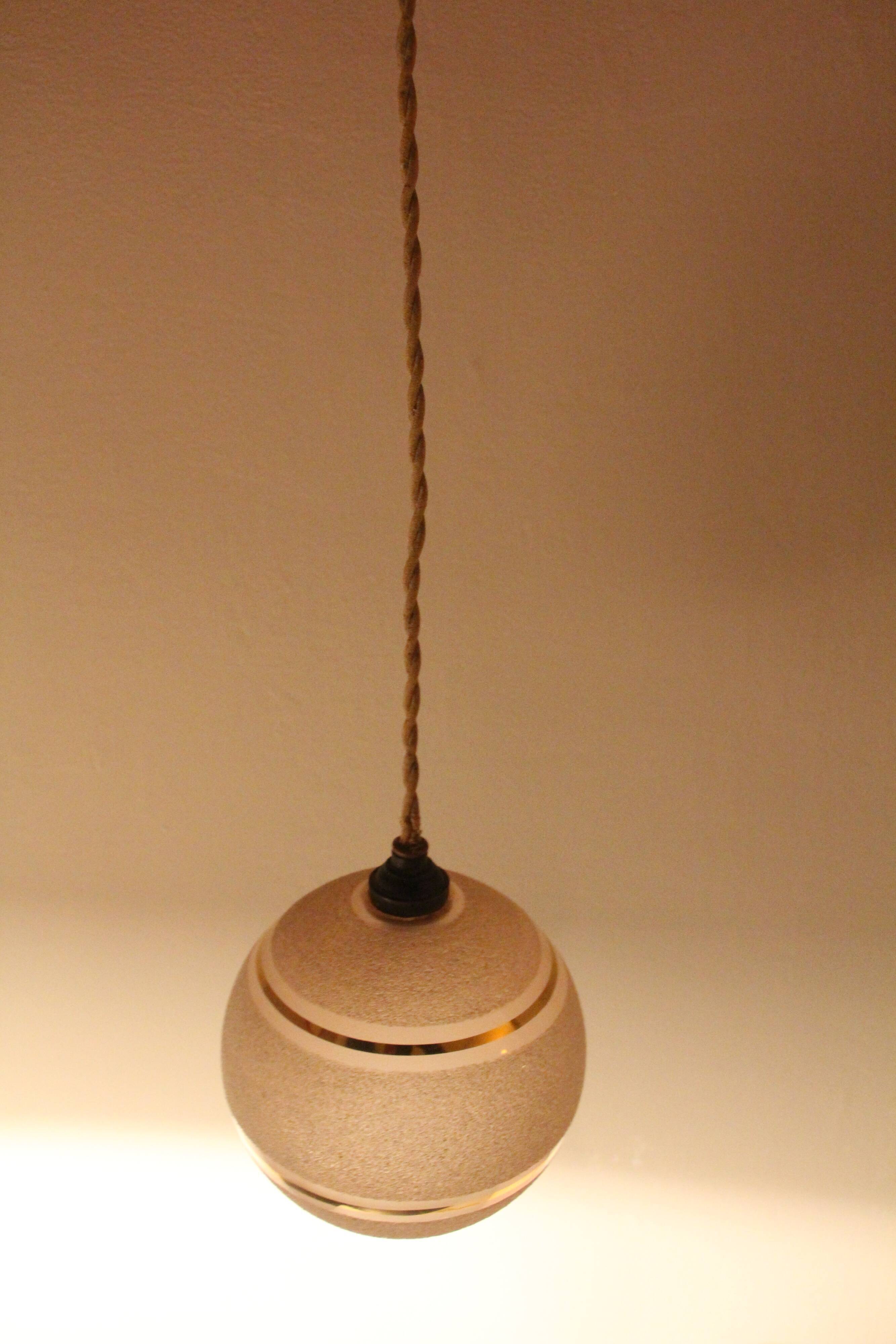 Set of two Art Deco pendant lamps in pink and gold glass