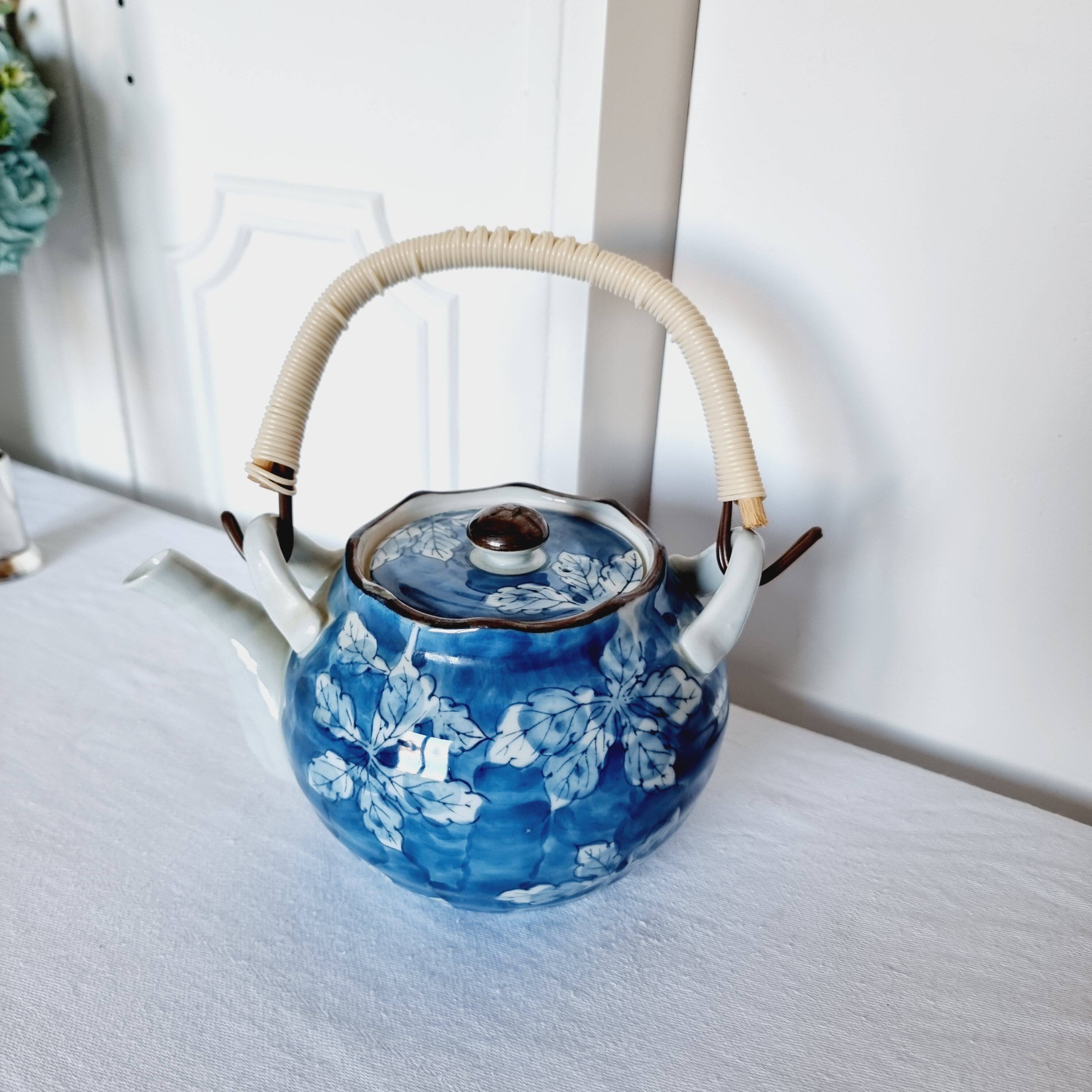 Handcrafted Japanese porcelain teapot hand painted in blue and white.