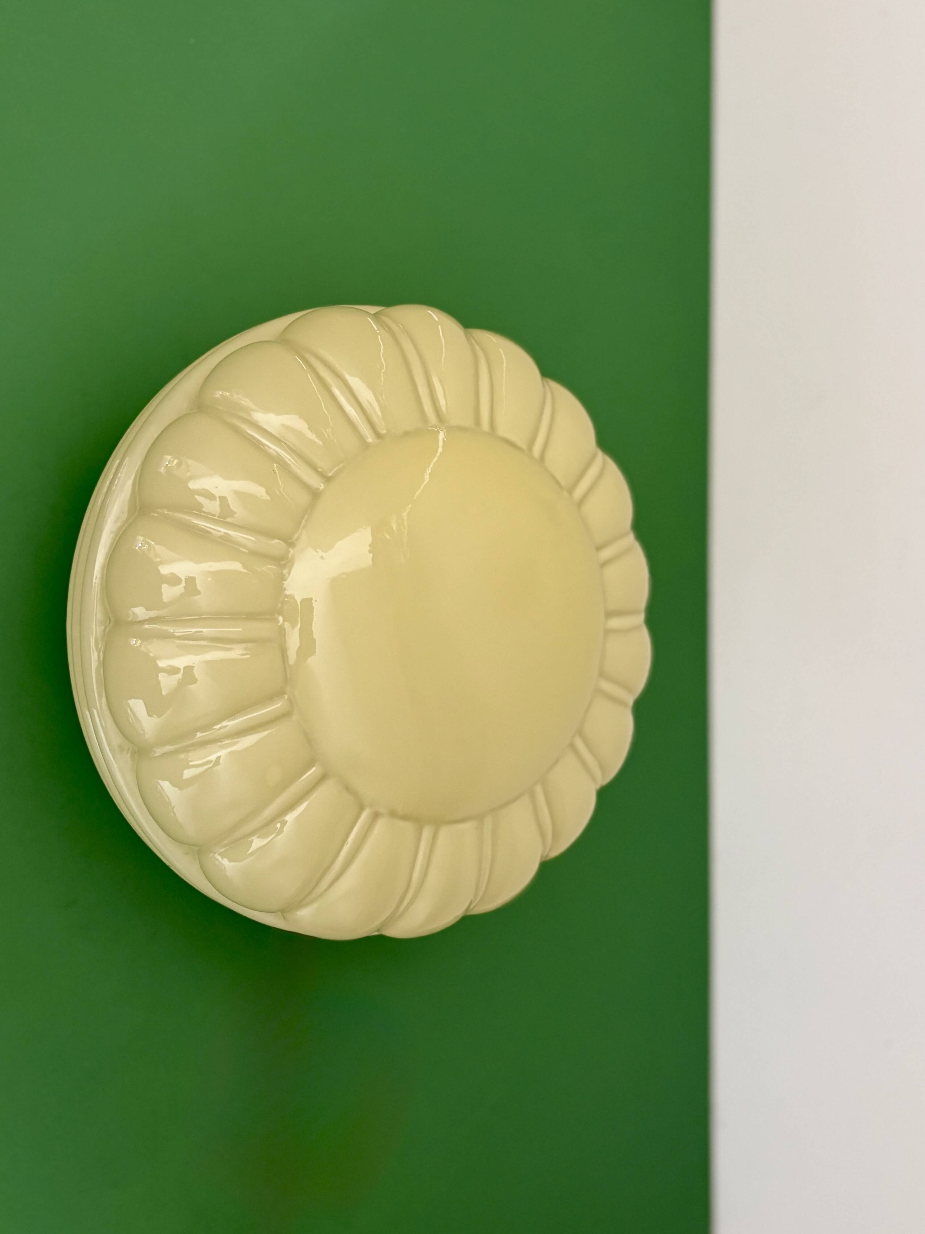 Vintage Art Deco globe wall or ceiling light in yellow opaline.