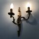 Antique pair of double-light bronze wall sconces with acanthus leaves. 1950s
