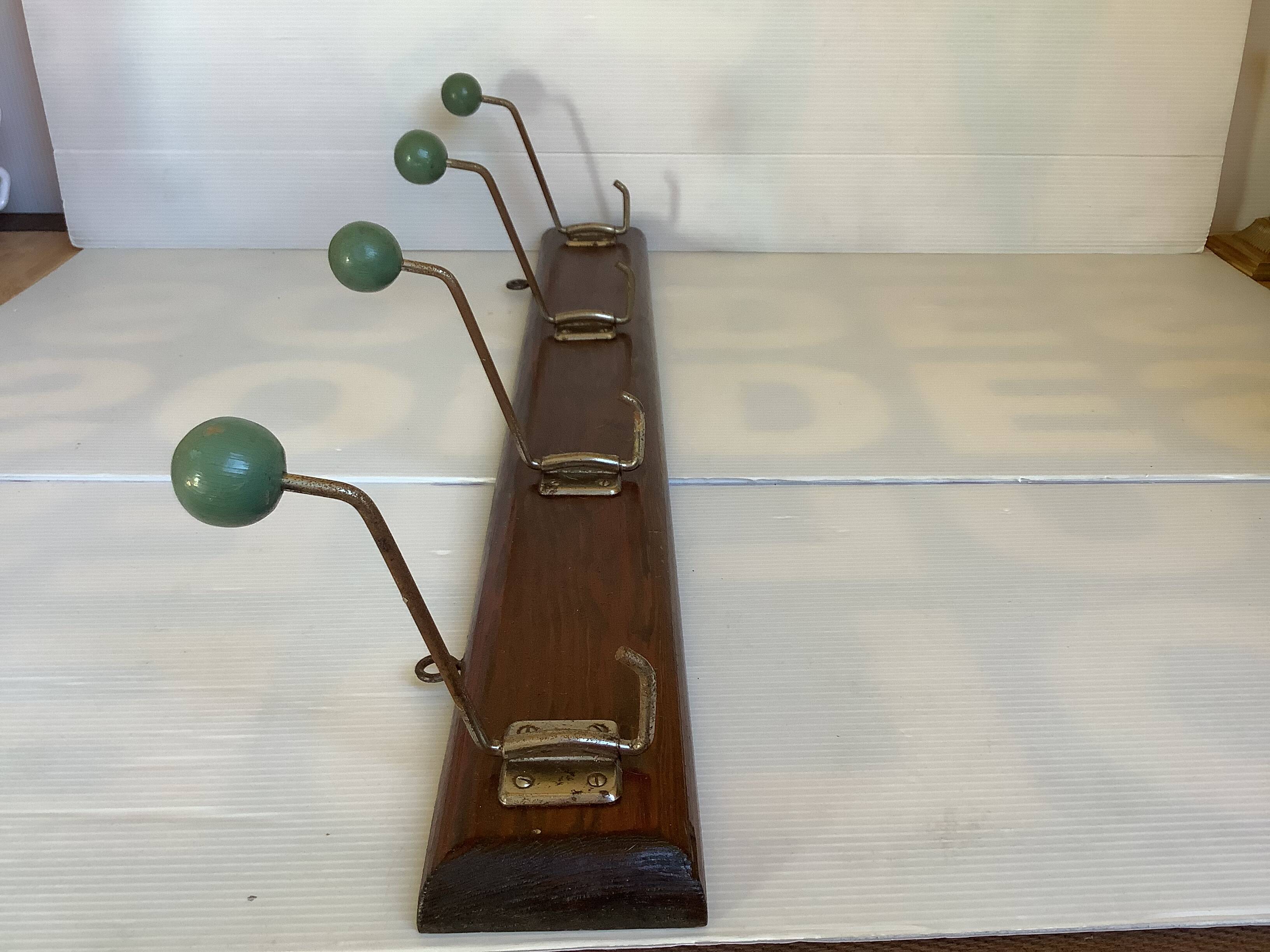 Old coat rack green balls wood metal