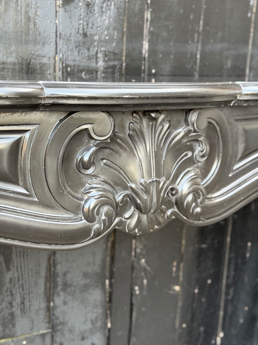 Louis XV style fireplace in black Belgian marble, circa 1880.