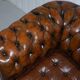 Restored vintage leather Chesterfield canapé in Thomas Chippendale style.