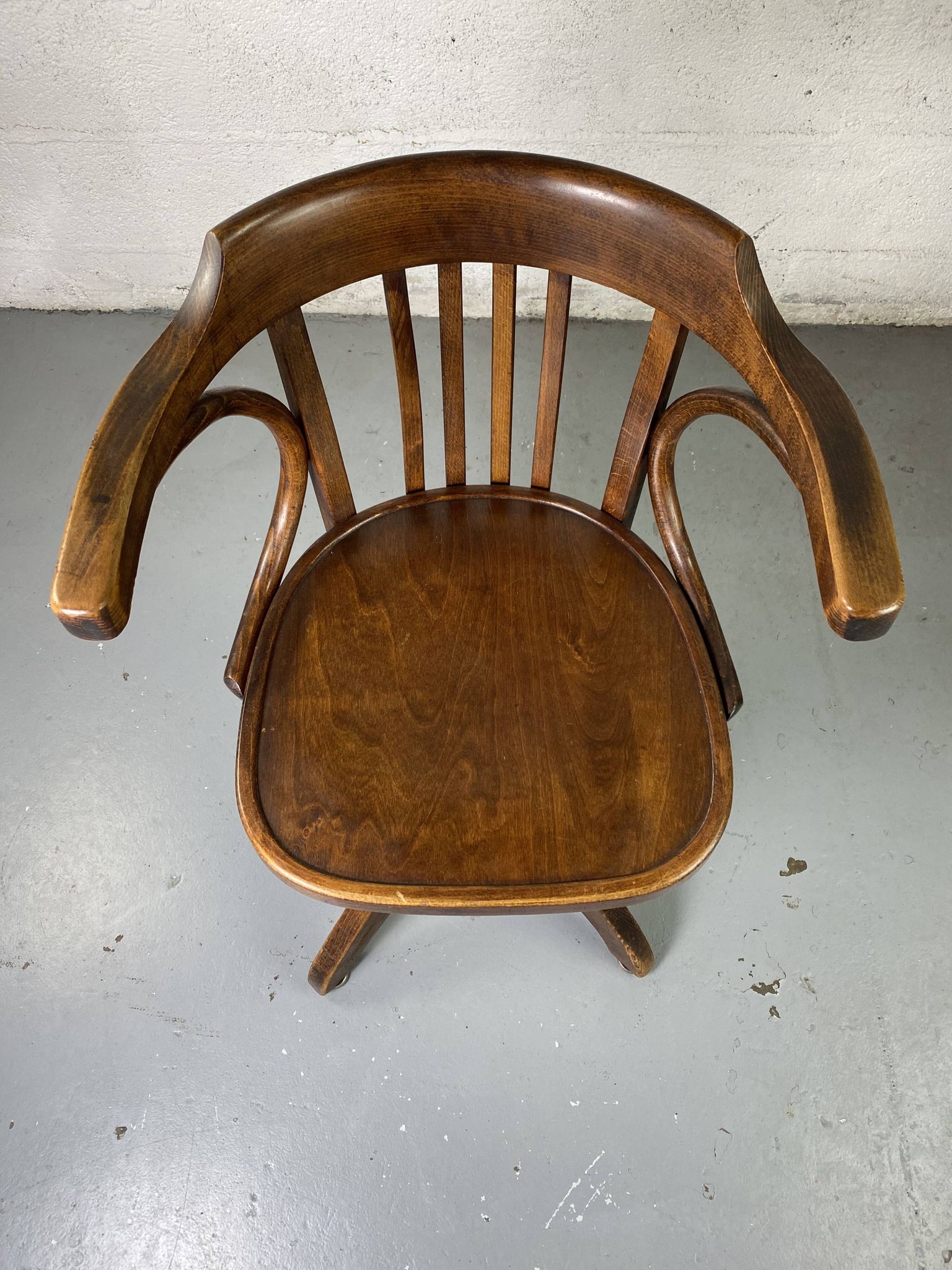 Baumann rotating wooden armchair