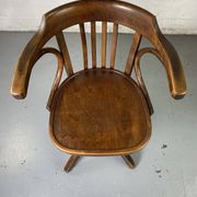 Baumann rotating wooden armchair