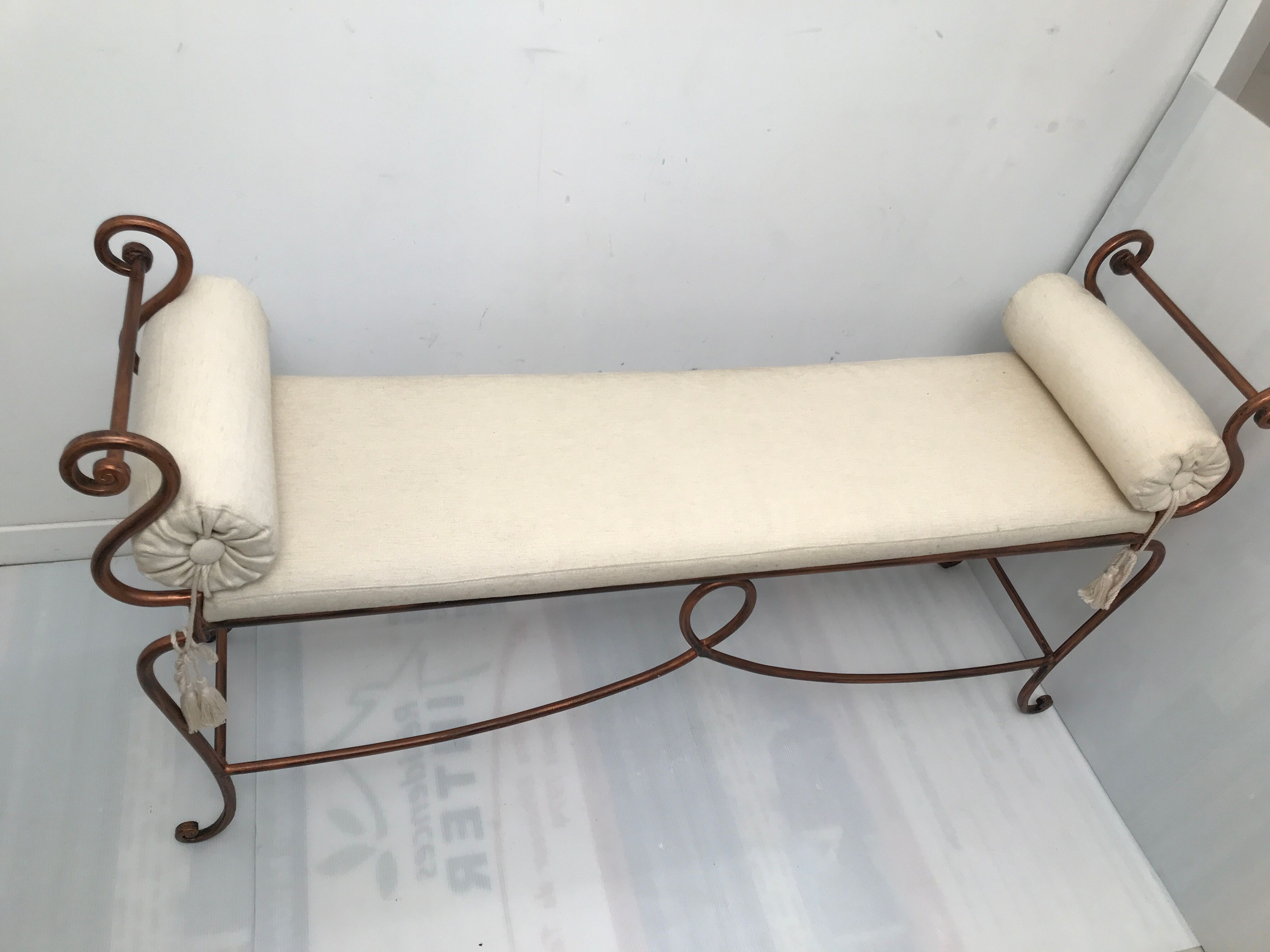 Copper wrought iron bench with cushions