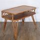 Vintage desk in rattan and wood from the 1960s.