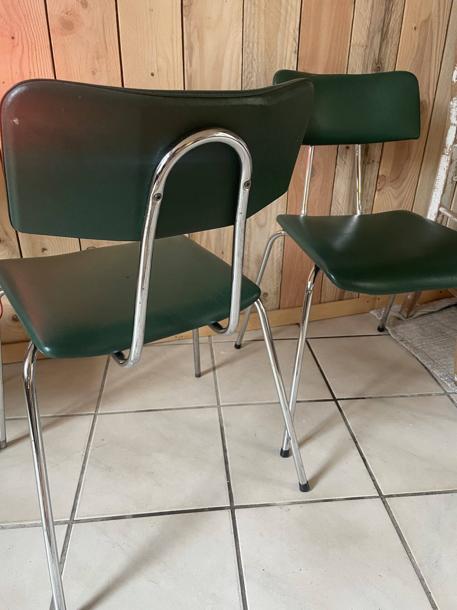 Pair of green faux leather chairs