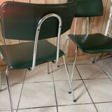 Pair of green faux leather chairs