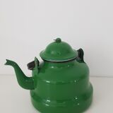 Old green kettle in enamelled metal