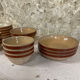 Lot of vintage Gien stoneware from France, 14 pieces including bowls and salad plates.