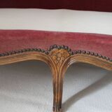 Faded pink velvet sofa