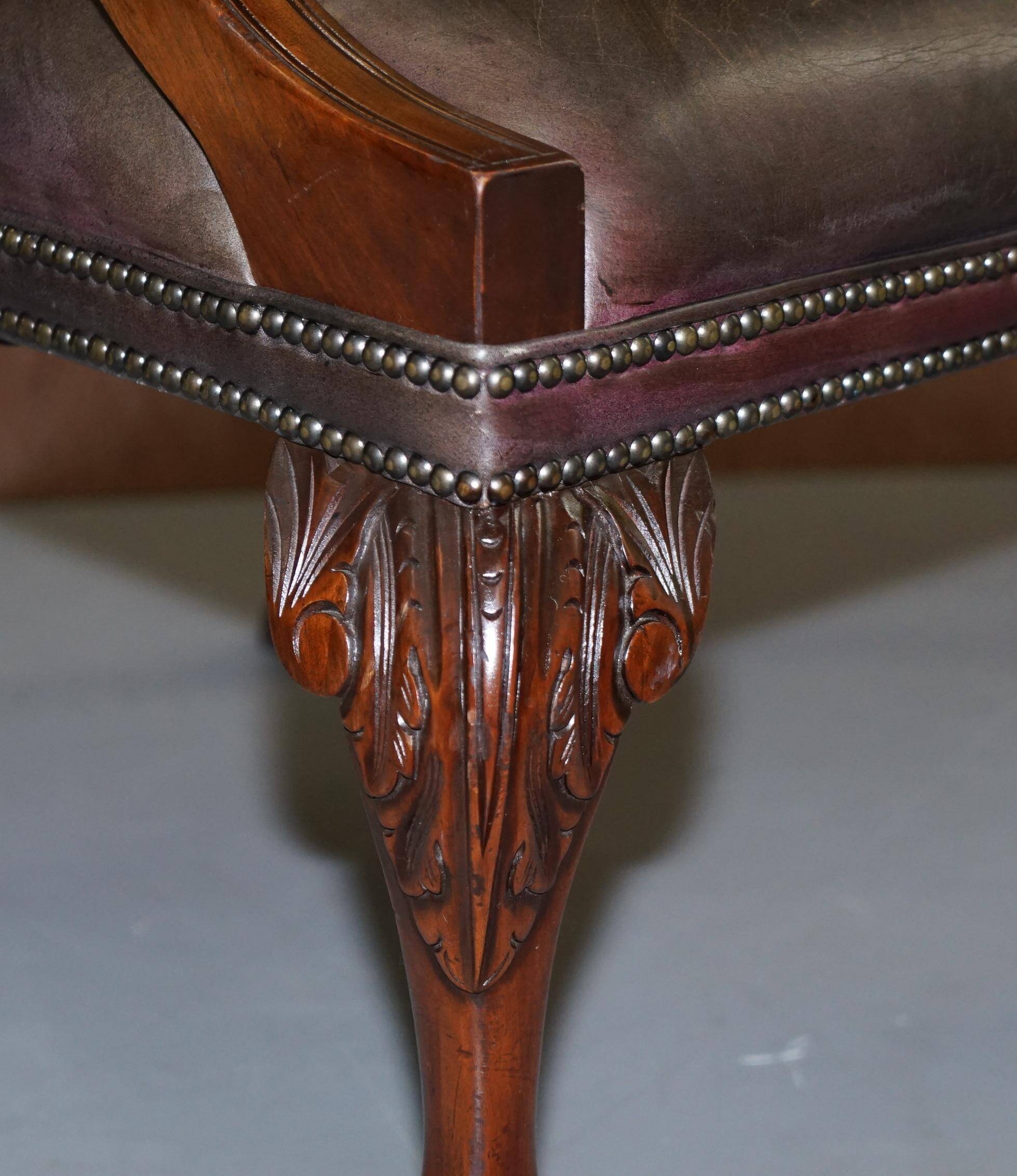 Gainsborough armchair George II leather Chesterfield hand-carved with claw and ball feet.