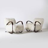 Pair of Jindrich Halabala H 269 lounge chairs in mongolian sheepskin