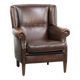 Subtle sheepskin wingback armchair with a deep cognac colour