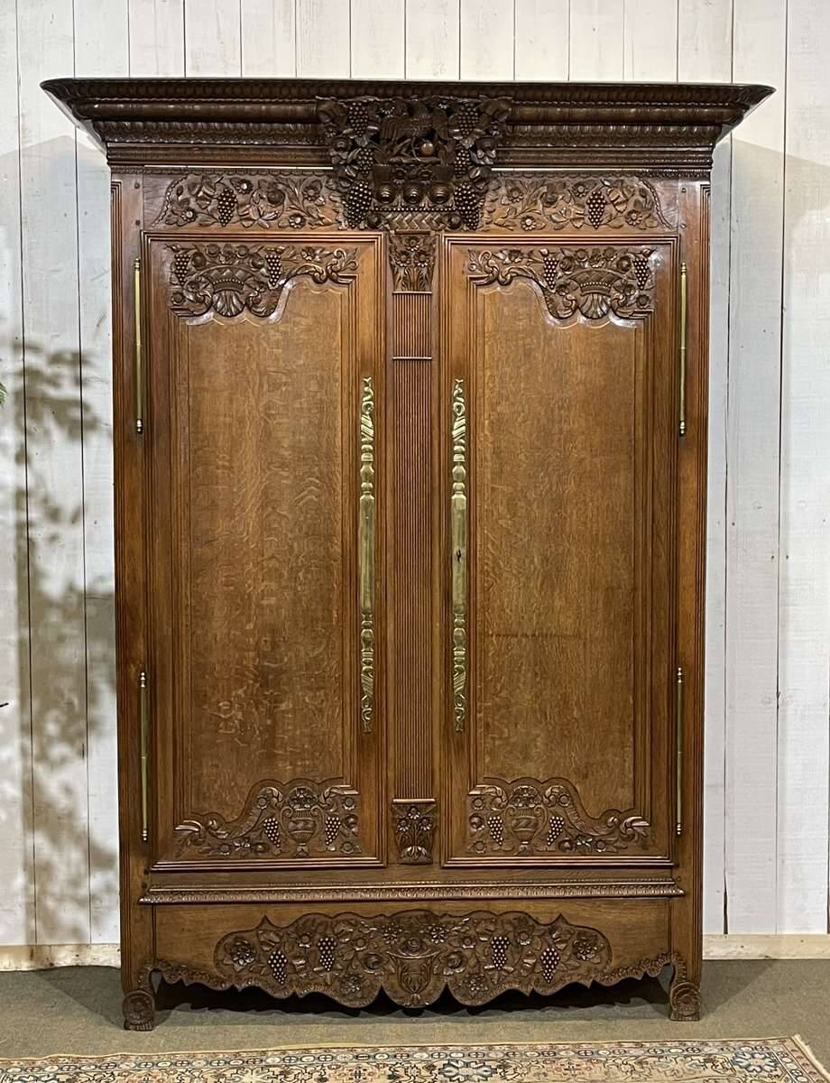 19th-century Norman wedding armoire in blonde oak.