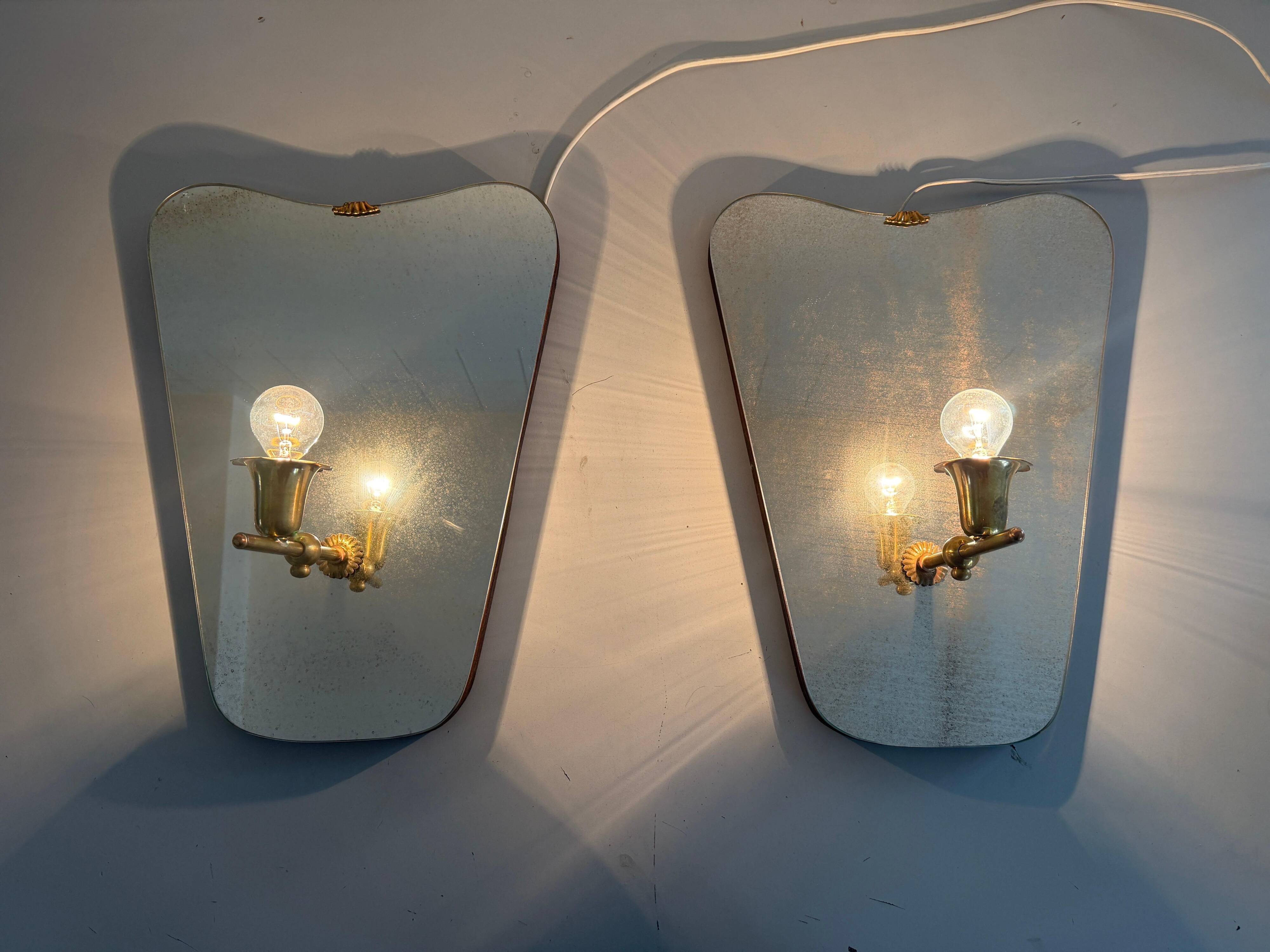 Pair of brass wall lights with mirrors, mid-20th century, Italy, 1960.