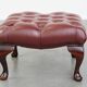 In very good condition elegant red/brown chesterfield ottoman made of cow leather