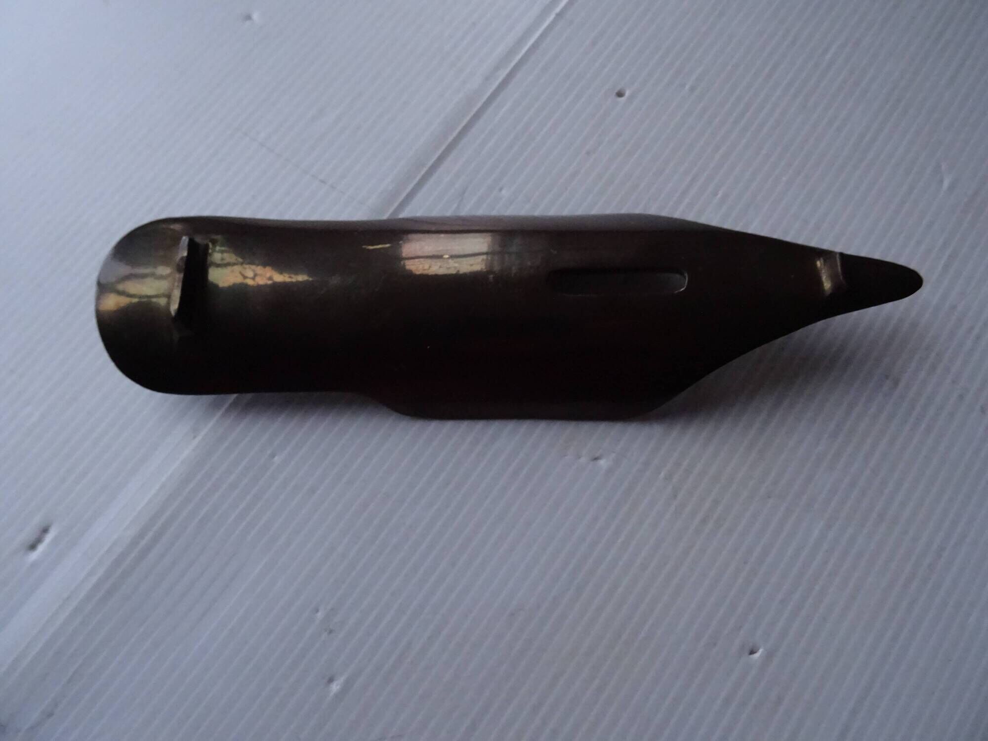 Empty feather holder bronze office pocket representing a pen feather