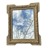 Miroir en bois et stuc doré