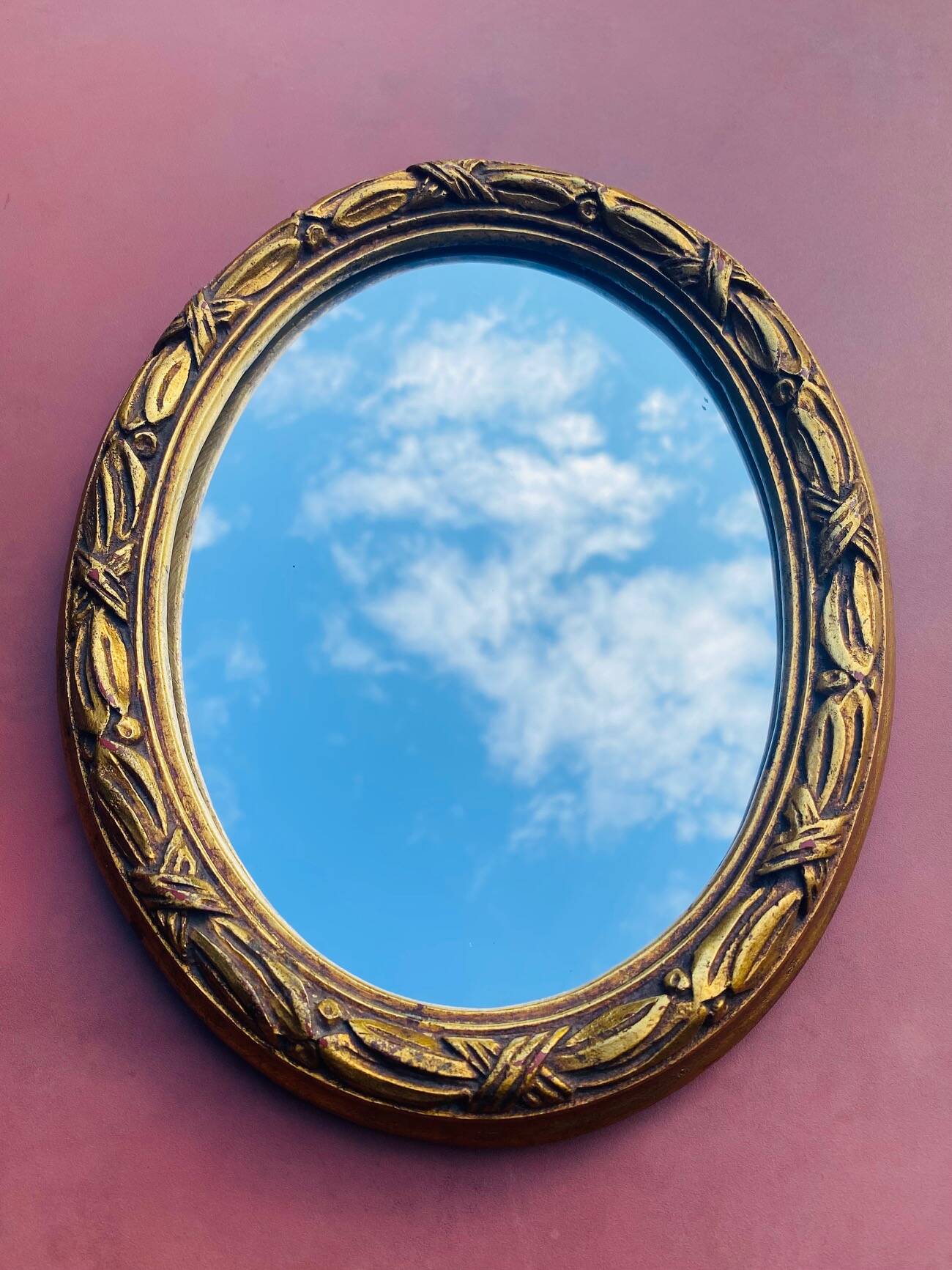 Small antique oval gilt mirror