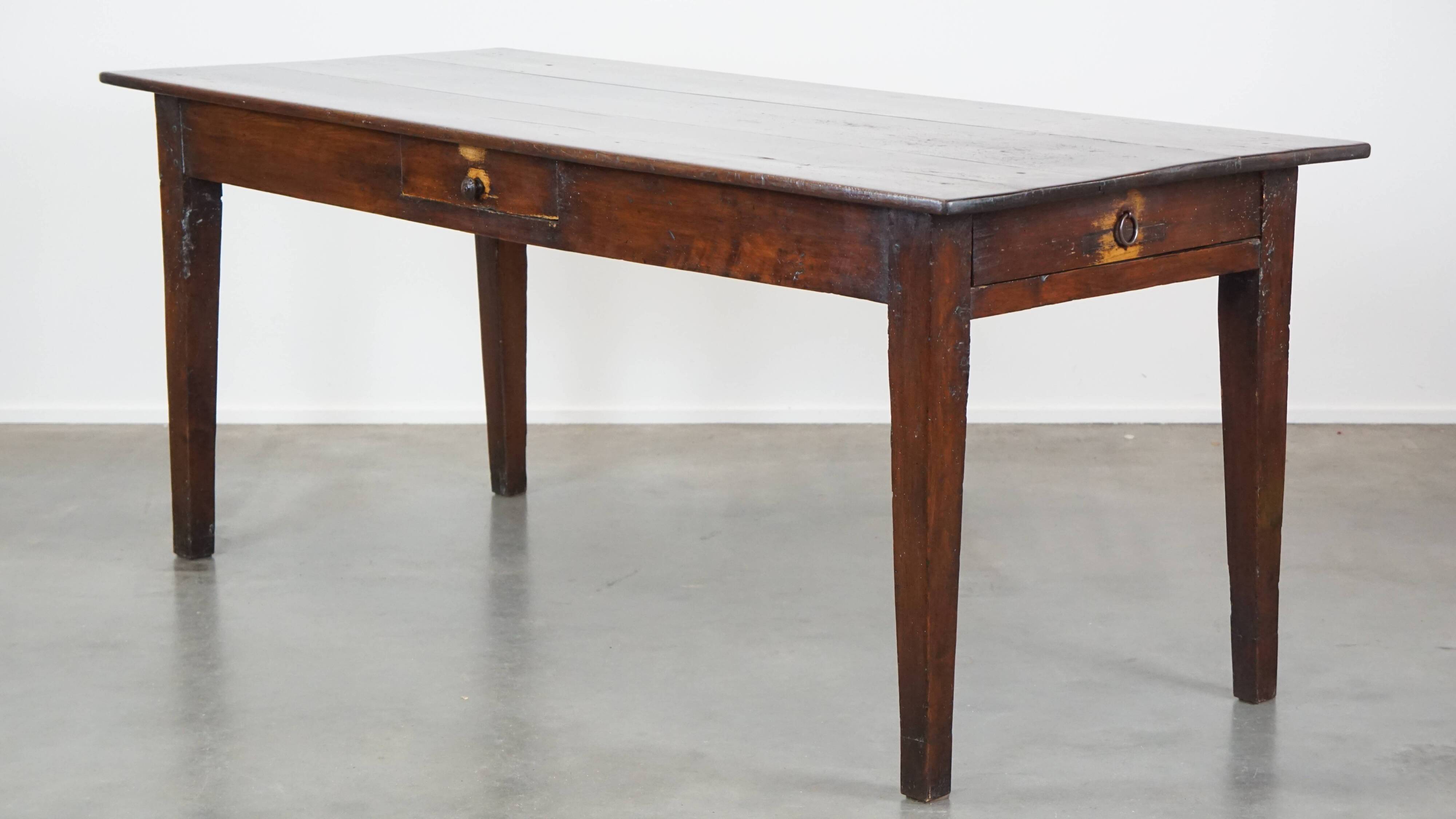 Antique French fruitwood dining table with 2 drawers and patina