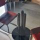 Round black smoked glass dining table + 2 terracotta chairs