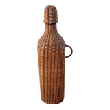 Bottle, old carafe in glass and wicker, 1950s