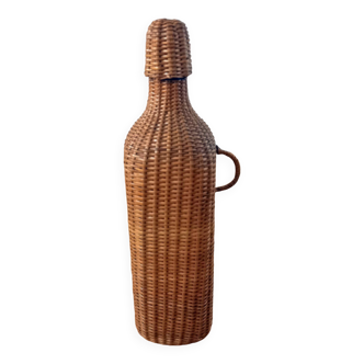 Bottle, old carafe in glass and wicker, 1950s