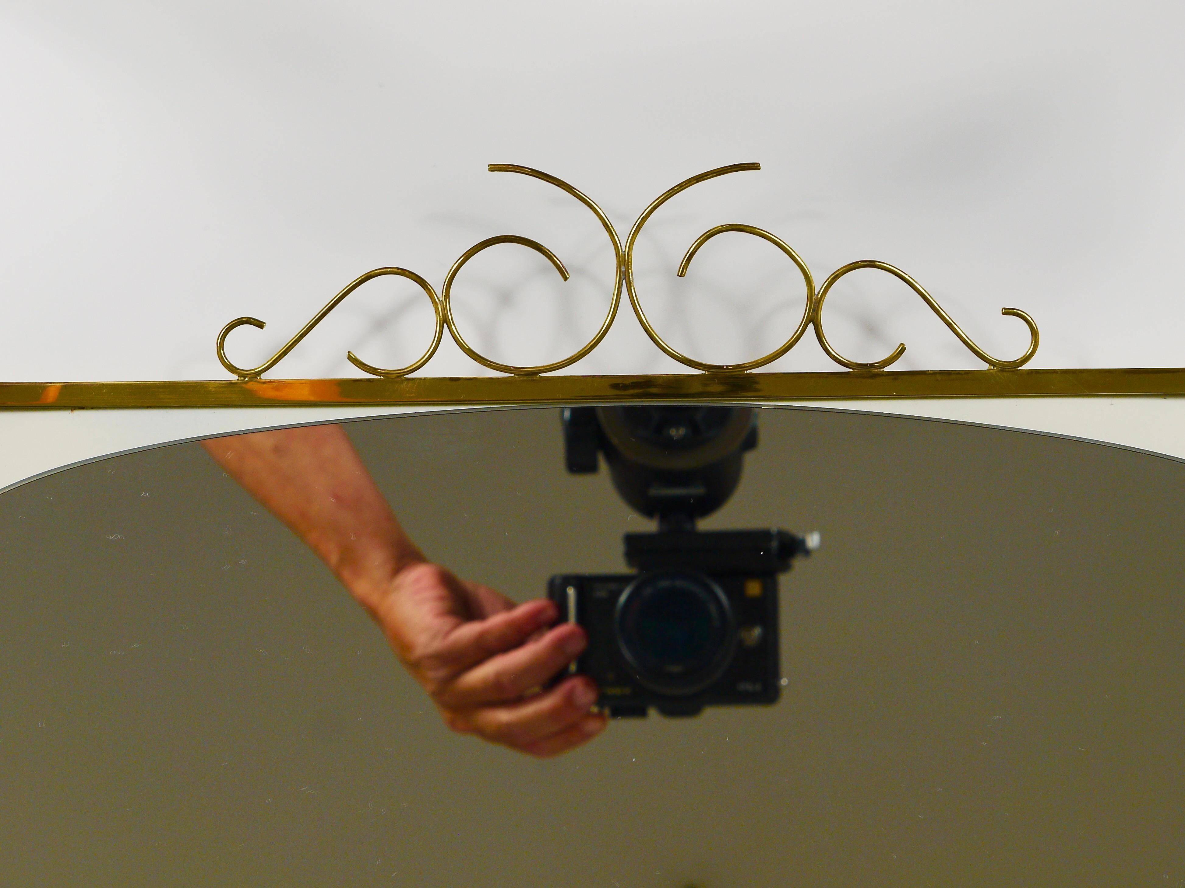 Mid-century illuminated wall mirror by Ernest Igl with brass crown, by Hillebrand.