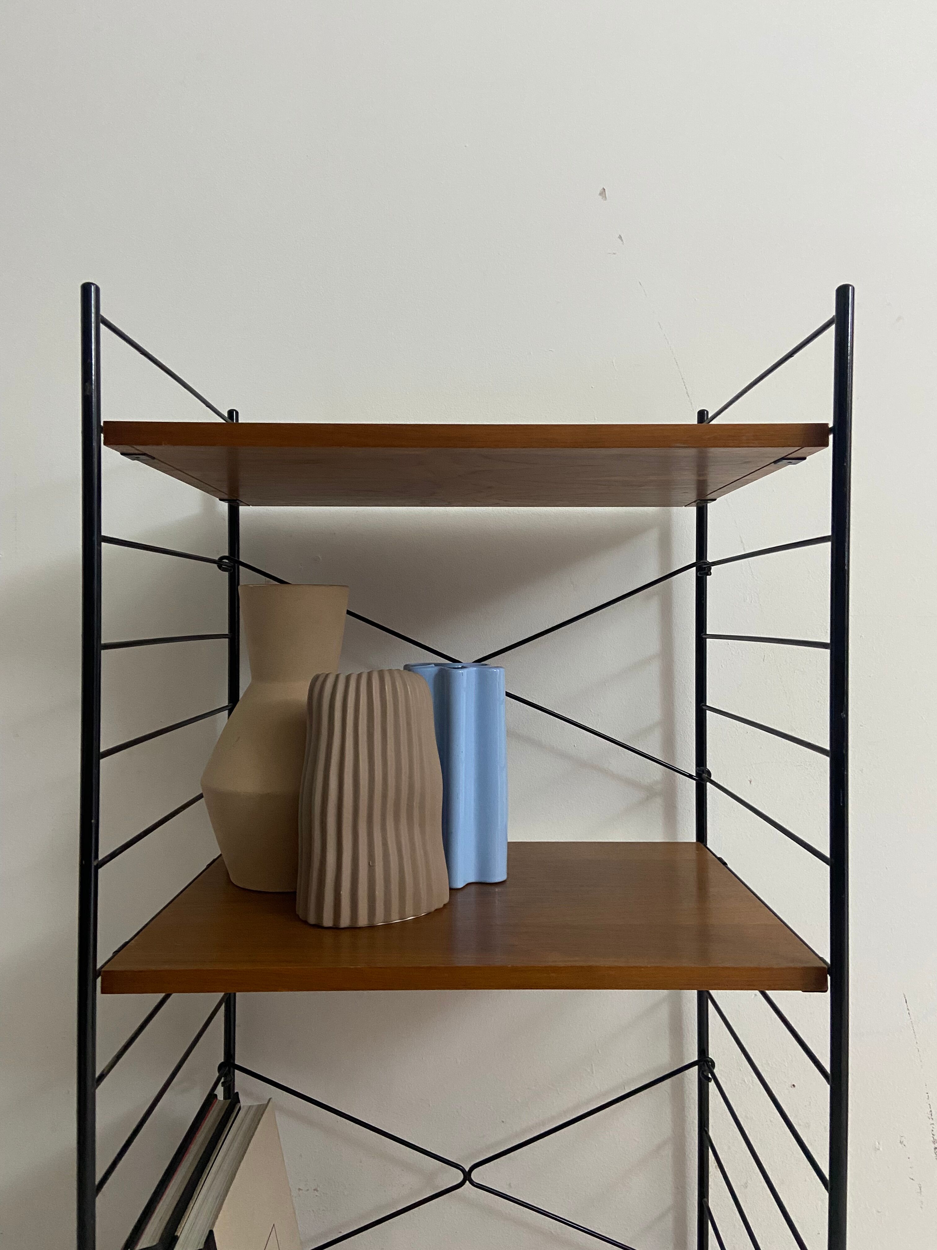 small vintage metal and teak string bookshelf