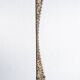 Indonesian construction element in carved wood with intertwined plant motifs mounted on a base (fri