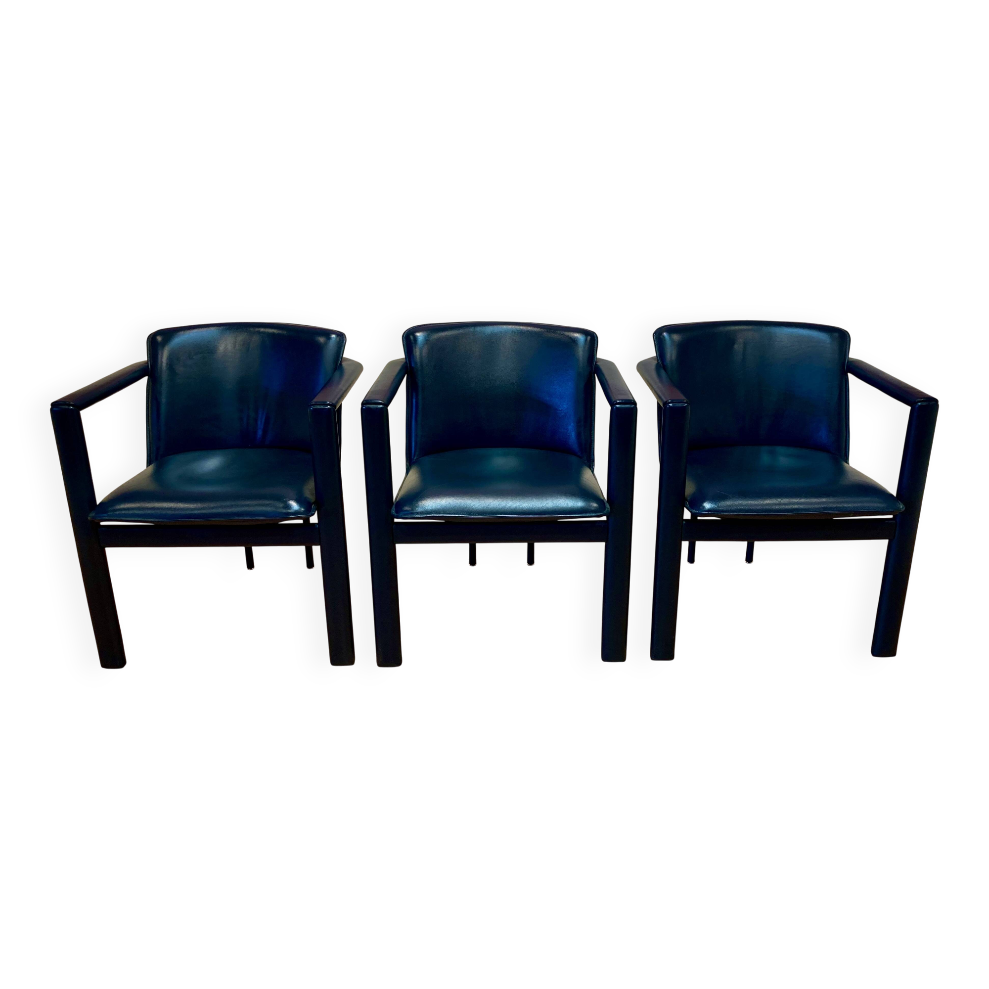 Set of 3 designer leather and metal armchairs.