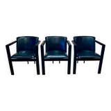 Set of 3 designer leather and metal armchairs.