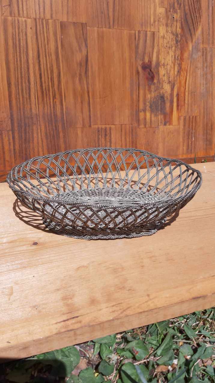 flat basket cut center table in woven metal