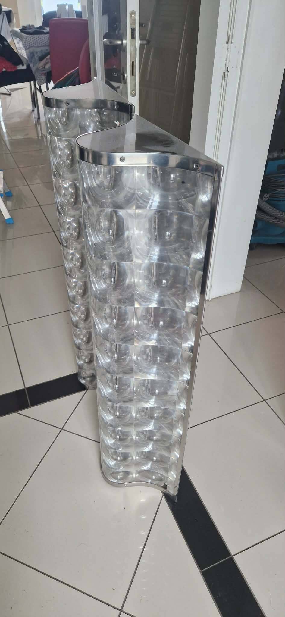 Gigantic 1970s plastic and chrome PVC wall lights, pair.