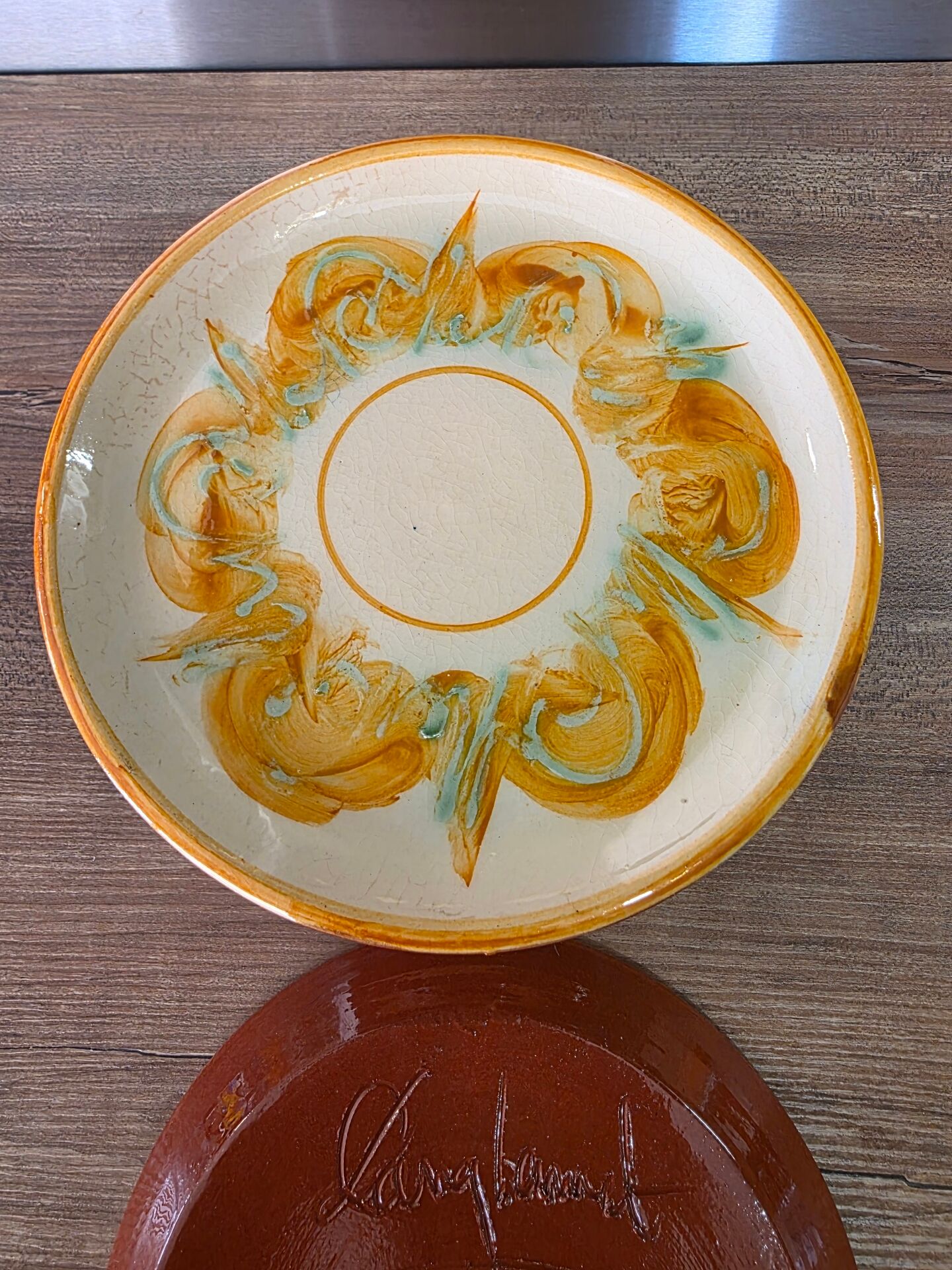 8 vintage dessert plates with a signed decoration.