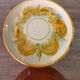 8 vintage dessert plates with a signed decoration.