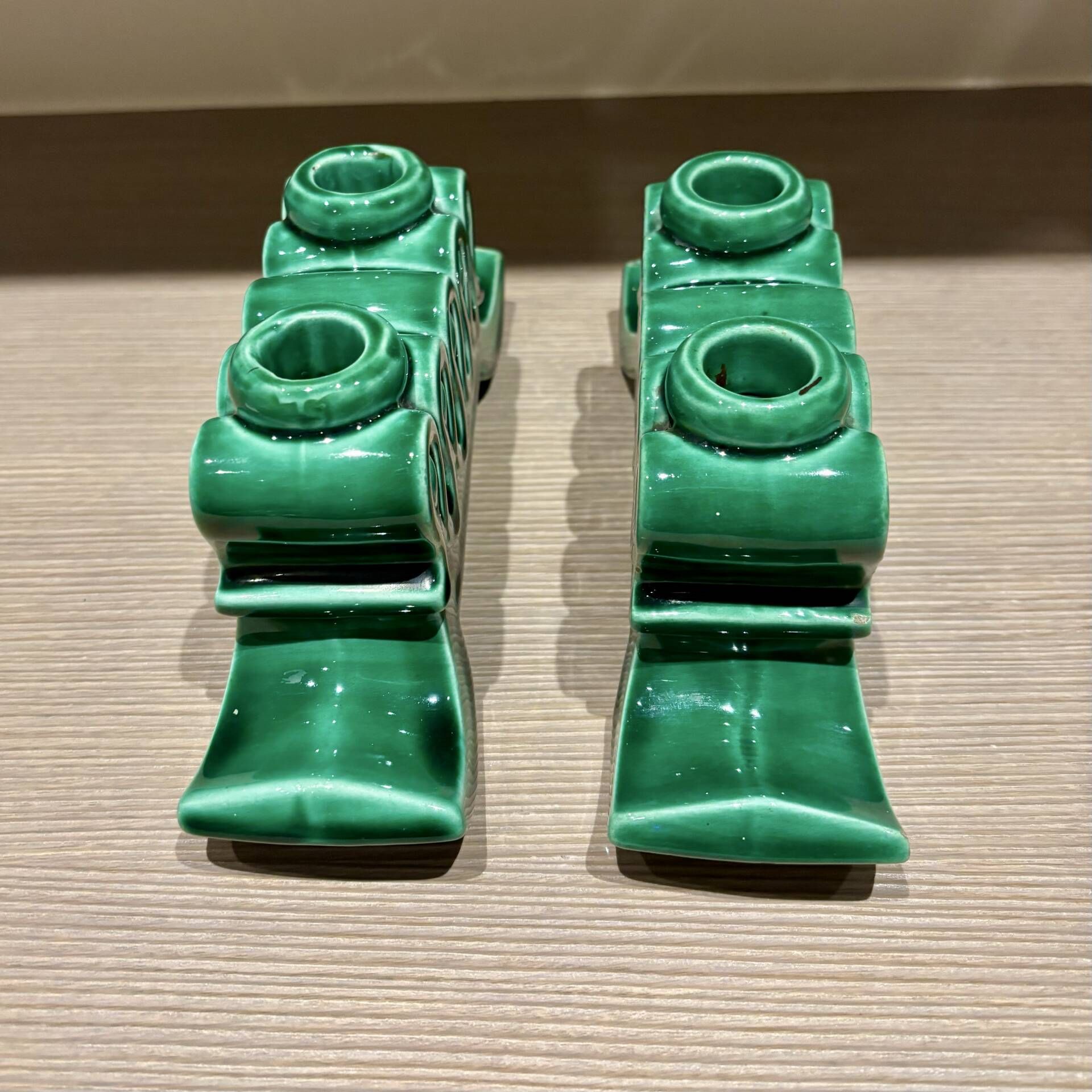Pair of Art Deco green ceramic candlesticks