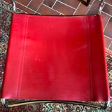 2 tubular chairs in red leather 1970