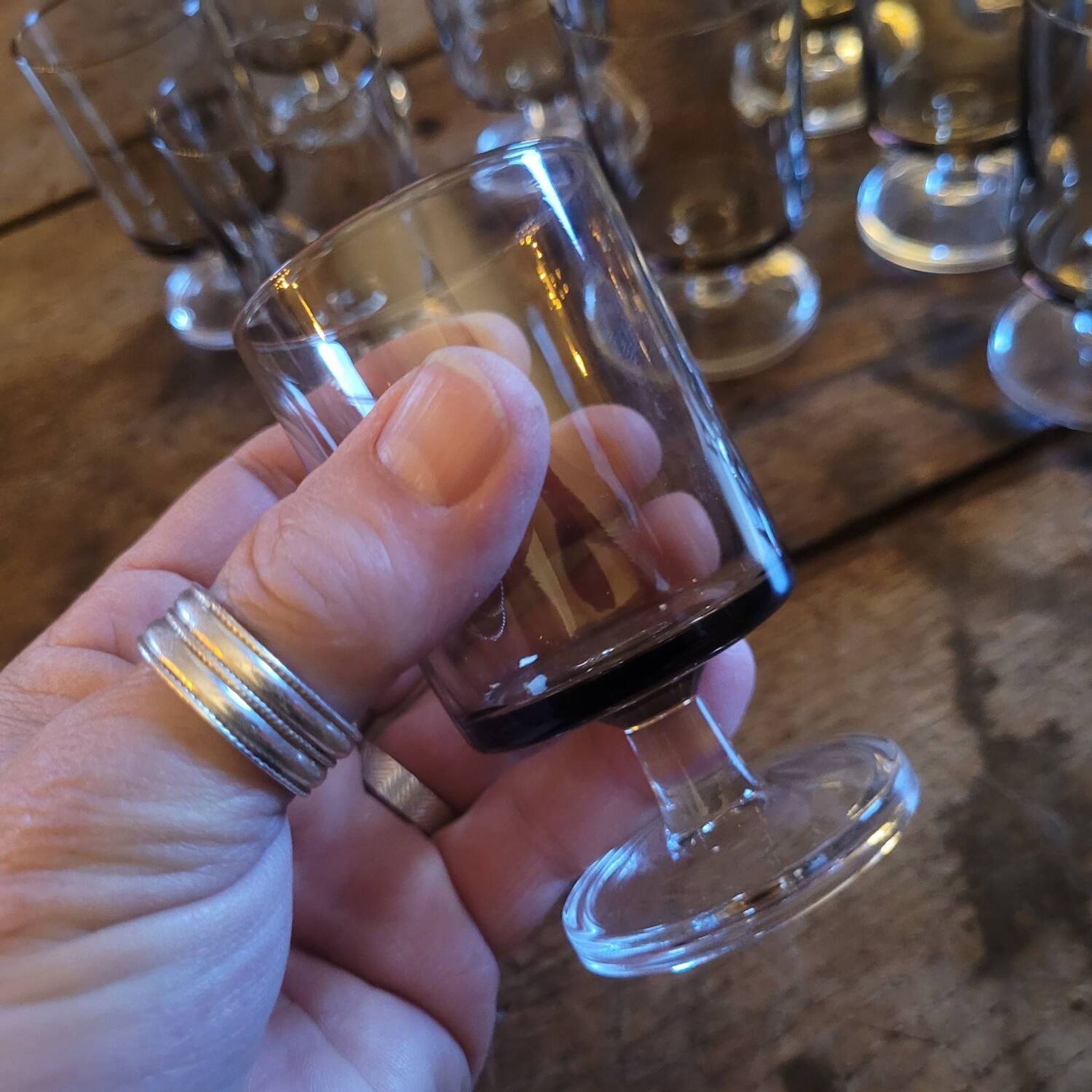 12 smoked glass stemmed glasses from the 70s and 80s.
