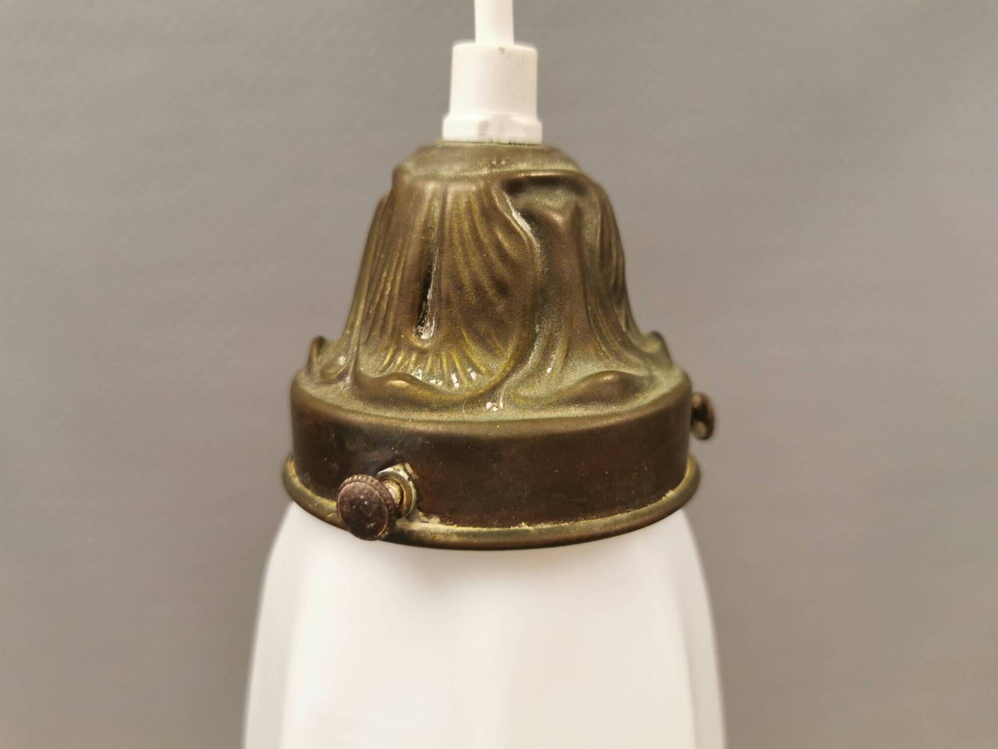 Small delicious tulip shaped hanging lamp in white opal glass with brass top.