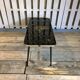 Vintage black and gold glass coffee table with conical legs from the 1940s.