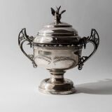 Vintage 1930s silver-plated footed bowl with lid by Warren Rogers New York, featuring a bird motif and ornate details.